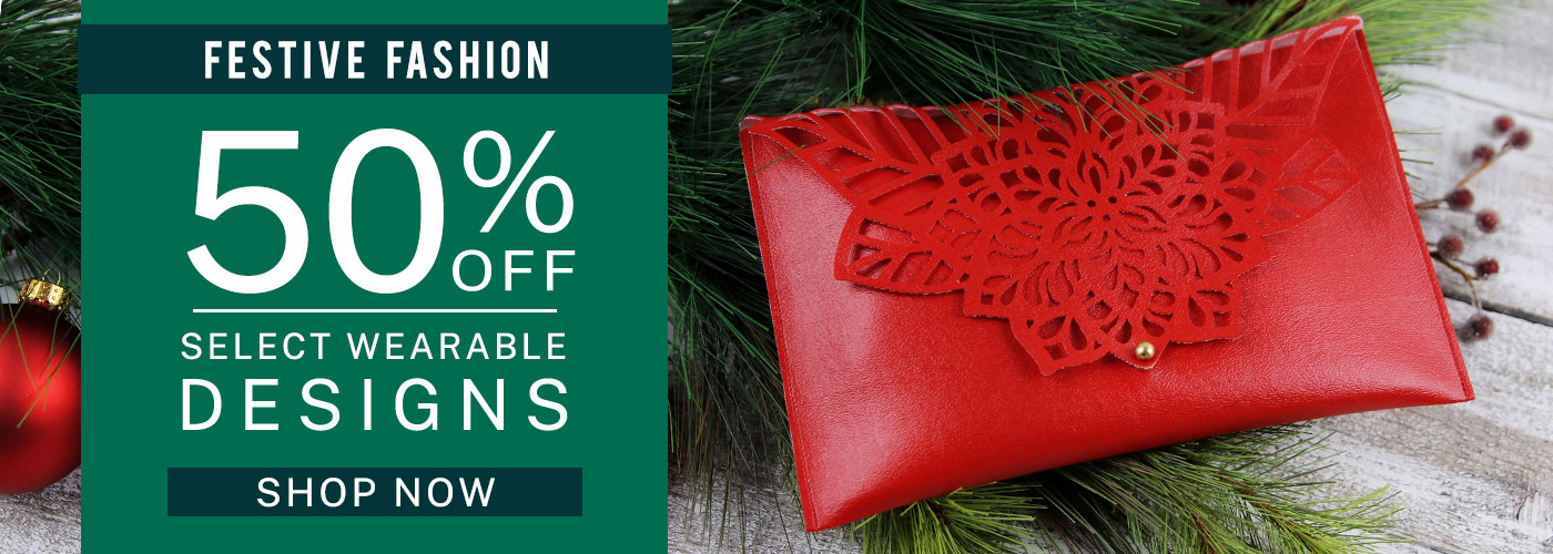Festive Fashion - 50% off Select Wearable Designs - Shop now. Image features: Poinsettia Clutch 