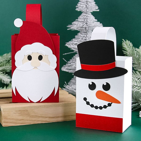 Christmas - image features: Papercut Santa and snowman treat bags surrounded by trees