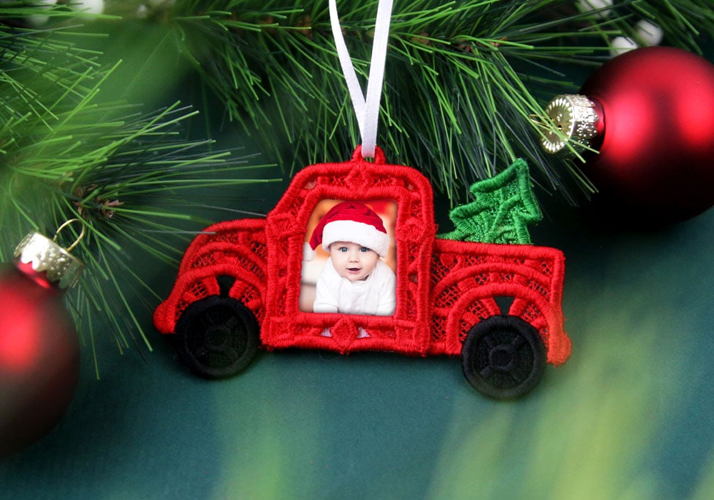 Freestanding lace christmas retro truck with baby wearing santa hat on tree