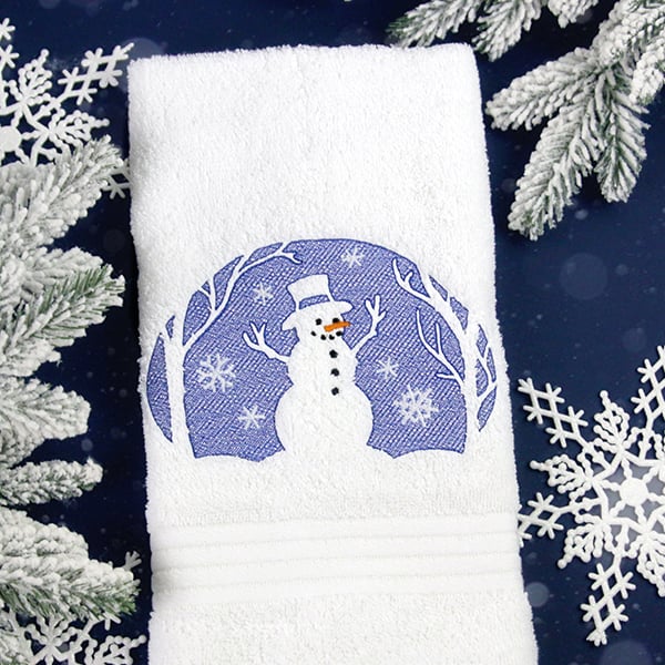 embossed designs - Winter snowman on bath towel with snowflakes and pine around