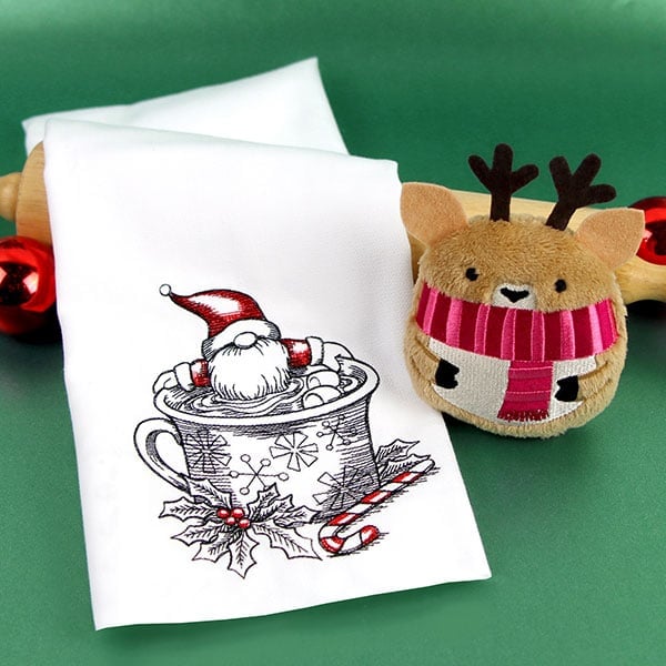 Christmas Designs - image features: Hot cocoa gnome on tea towel and In-the-Hoop reindeer ornament 